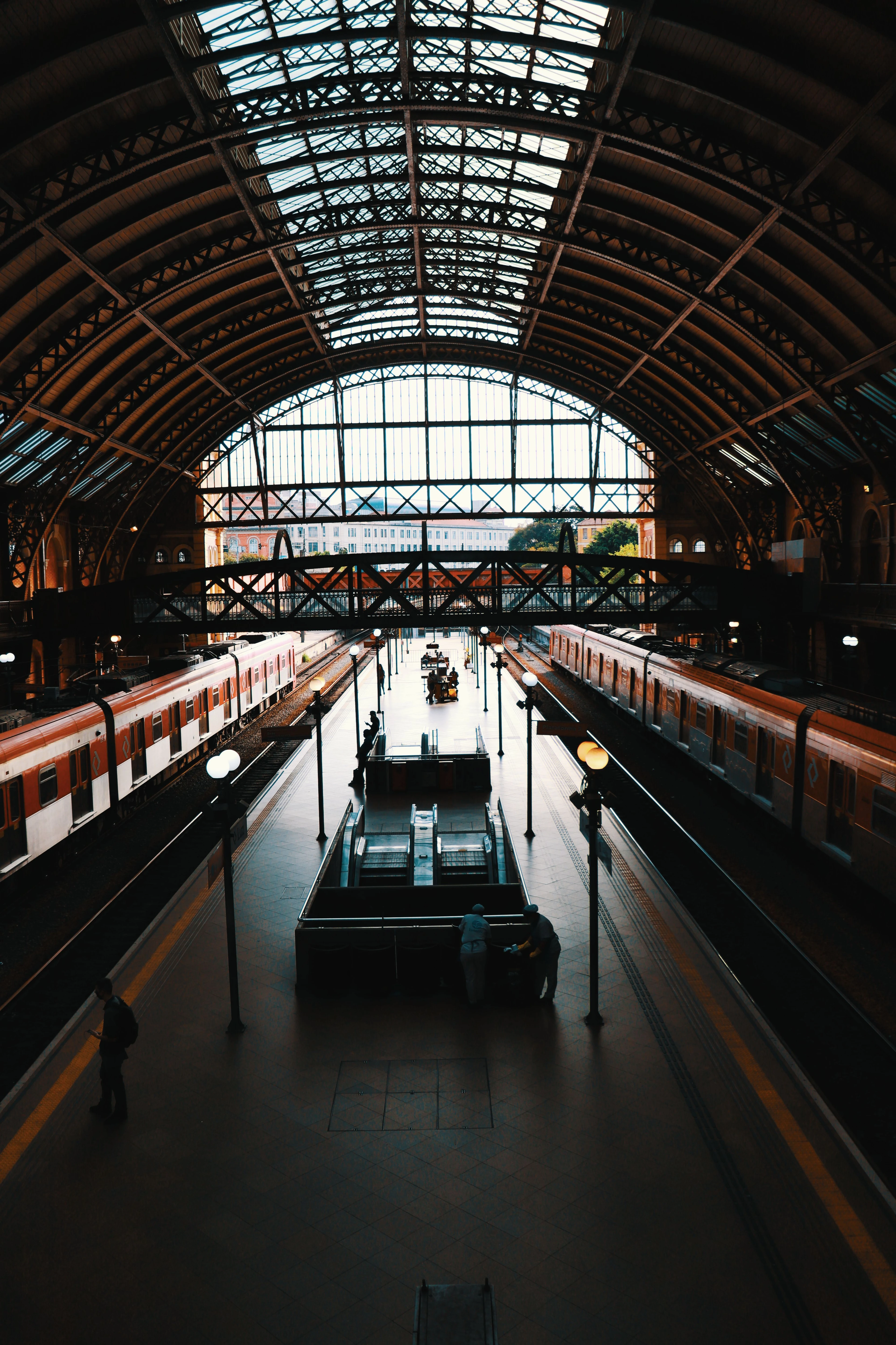 Railway tracks beneath the soaring metal canopy of Estação da Luz
