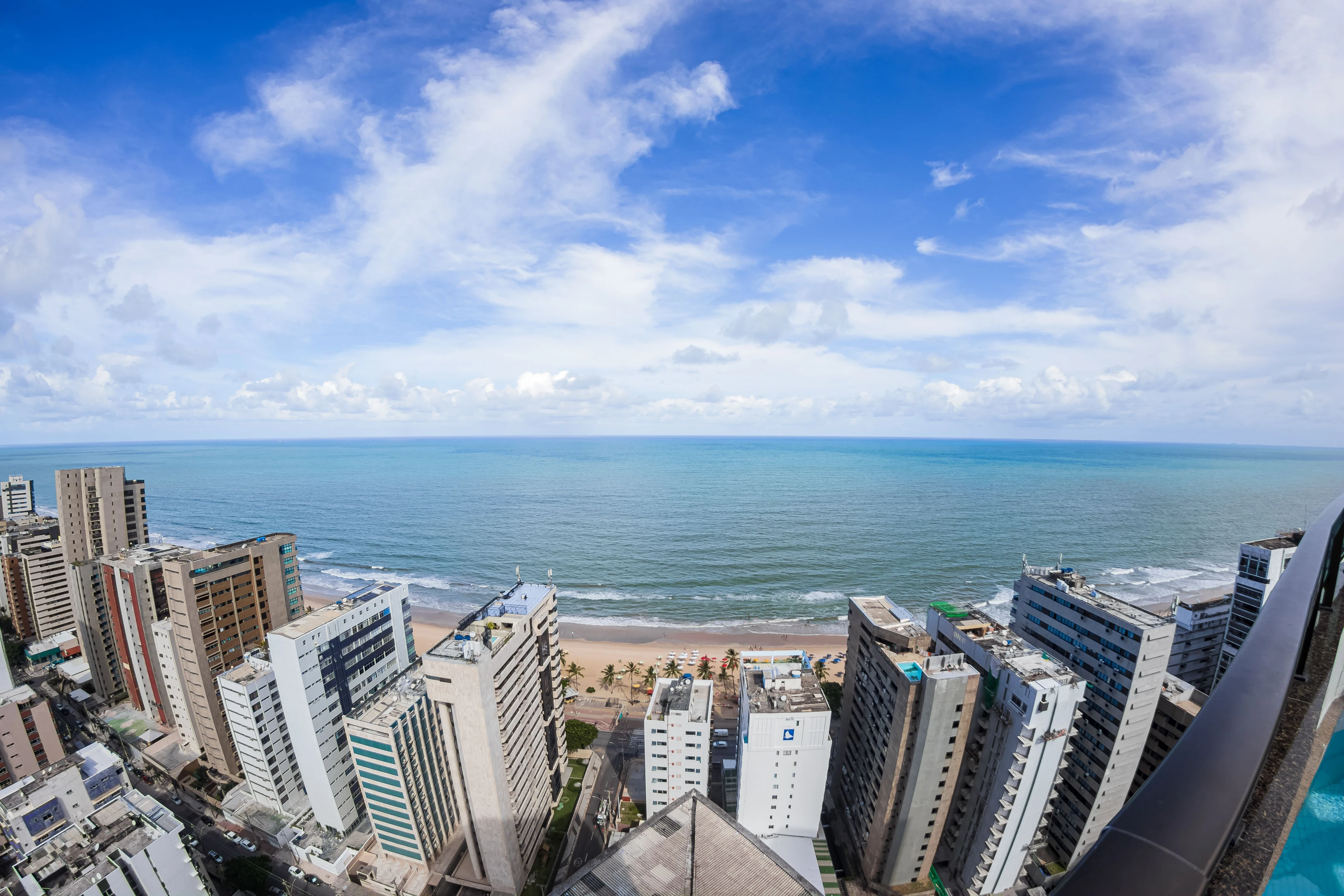 A dramatic aerial perspective along Boa Viagem’s city towers and oceanfront in Recife