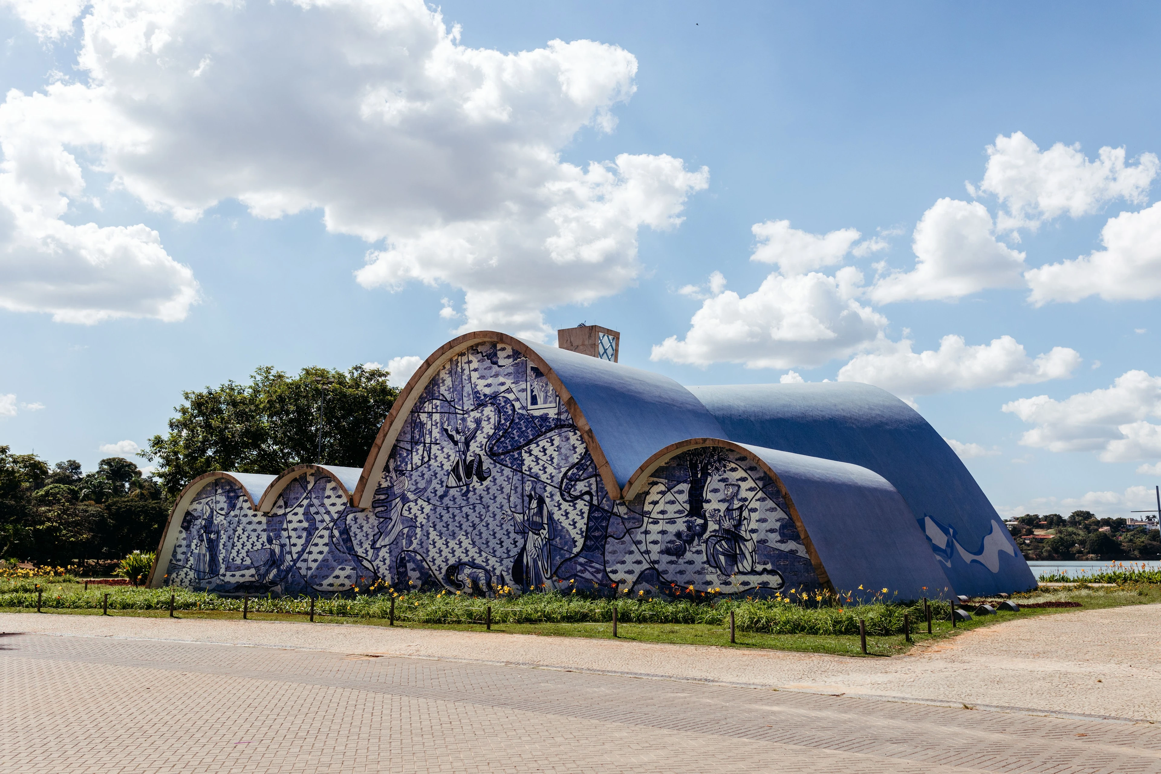 Niemeyer's sweeping church curves and blue-and-white tile mural at Pampulha
