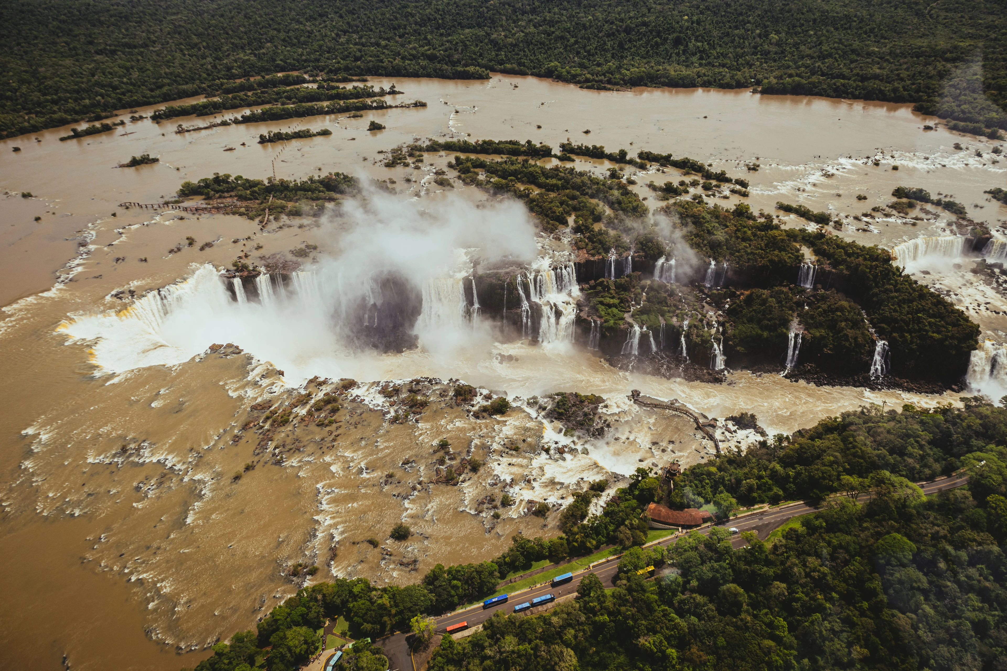 Powerful waterfalls and rising spray seen from above at Iguaçu
