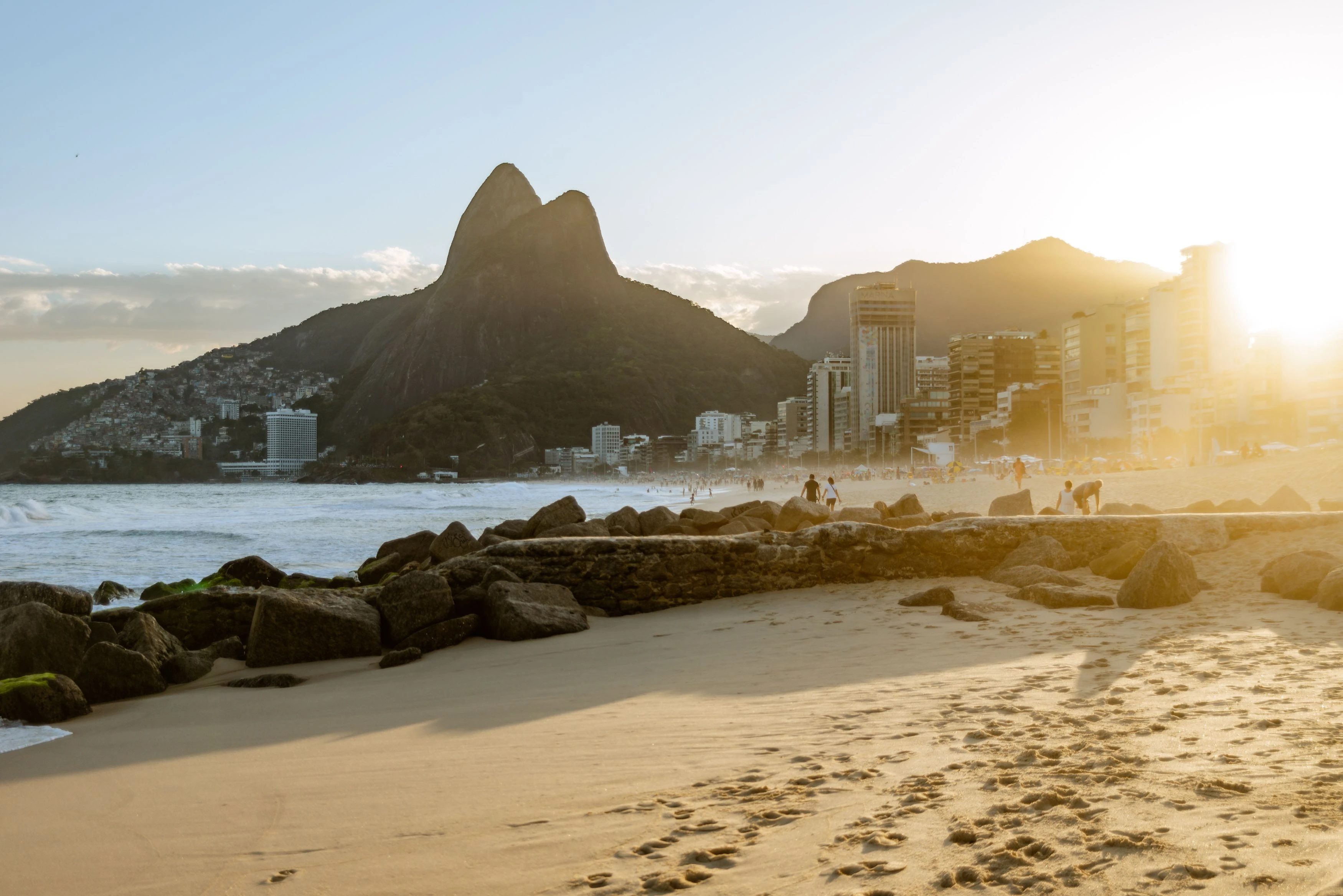 Warm sunset above Ipanema’s shore and the silhouettes of Dois Irmãos