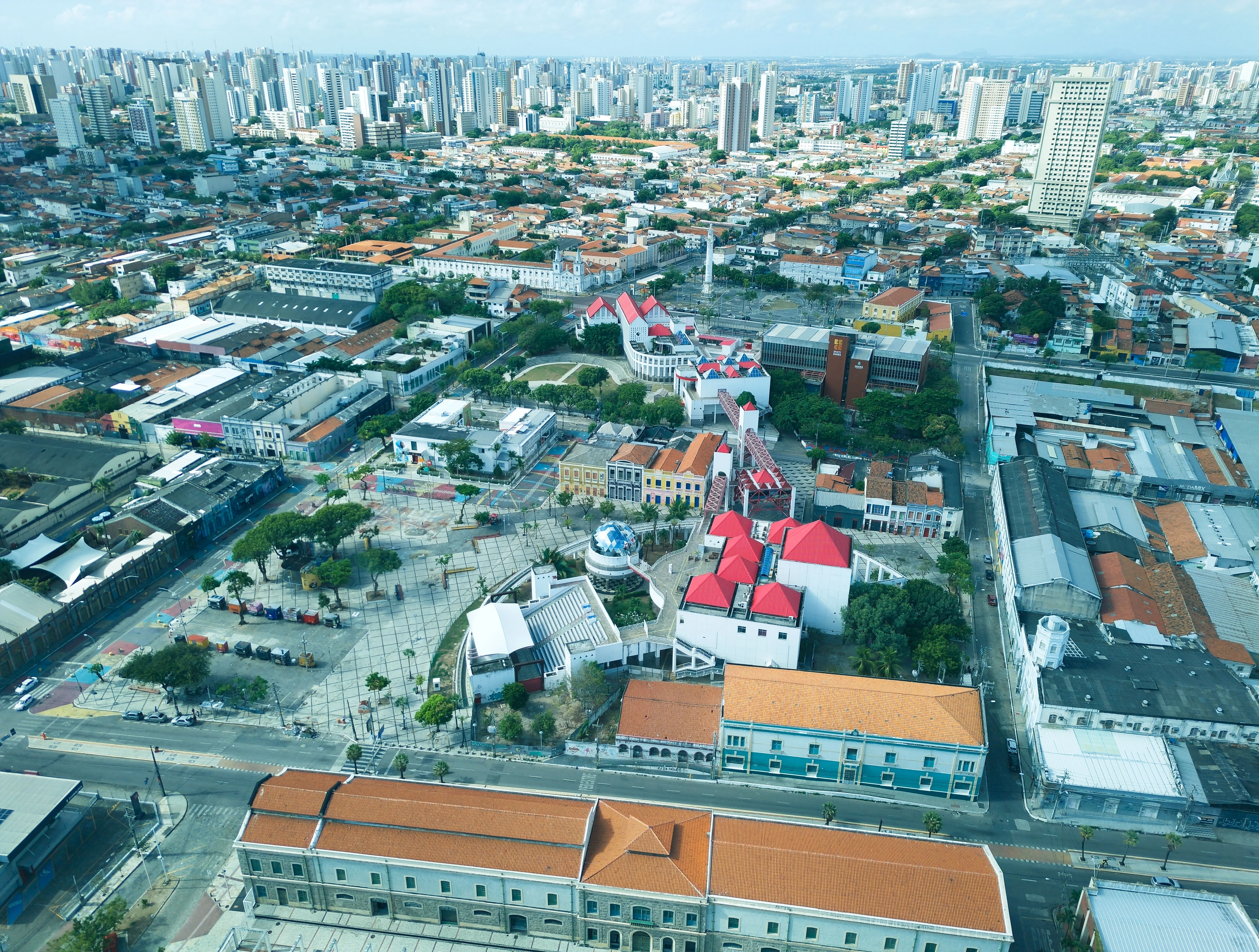 Red roofs and colorful historic buildings around Dragão do Mar seen from above in Fortaleza