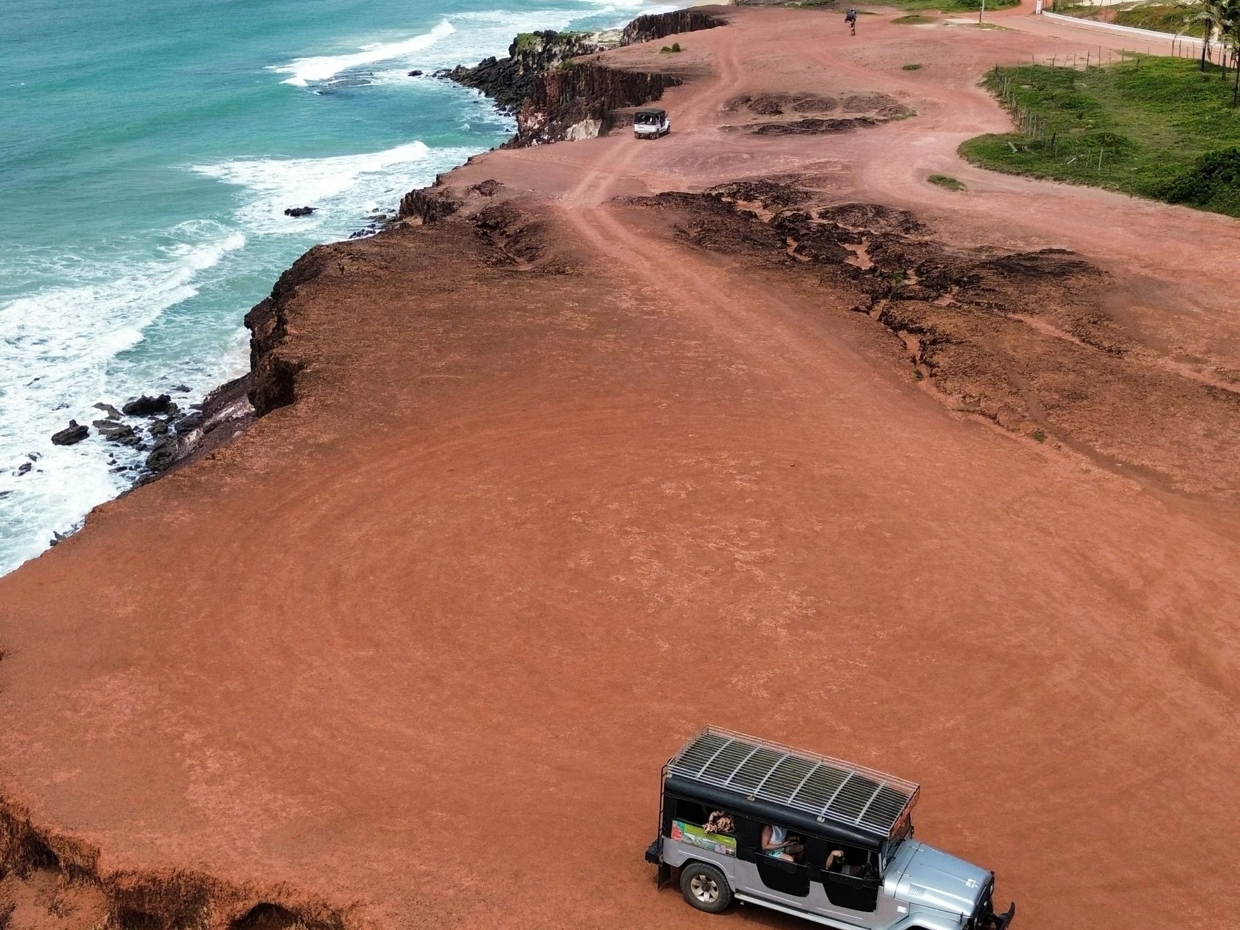 A vehicle above the red cliffs on the Pipa coast, Rio Grande do Norte.