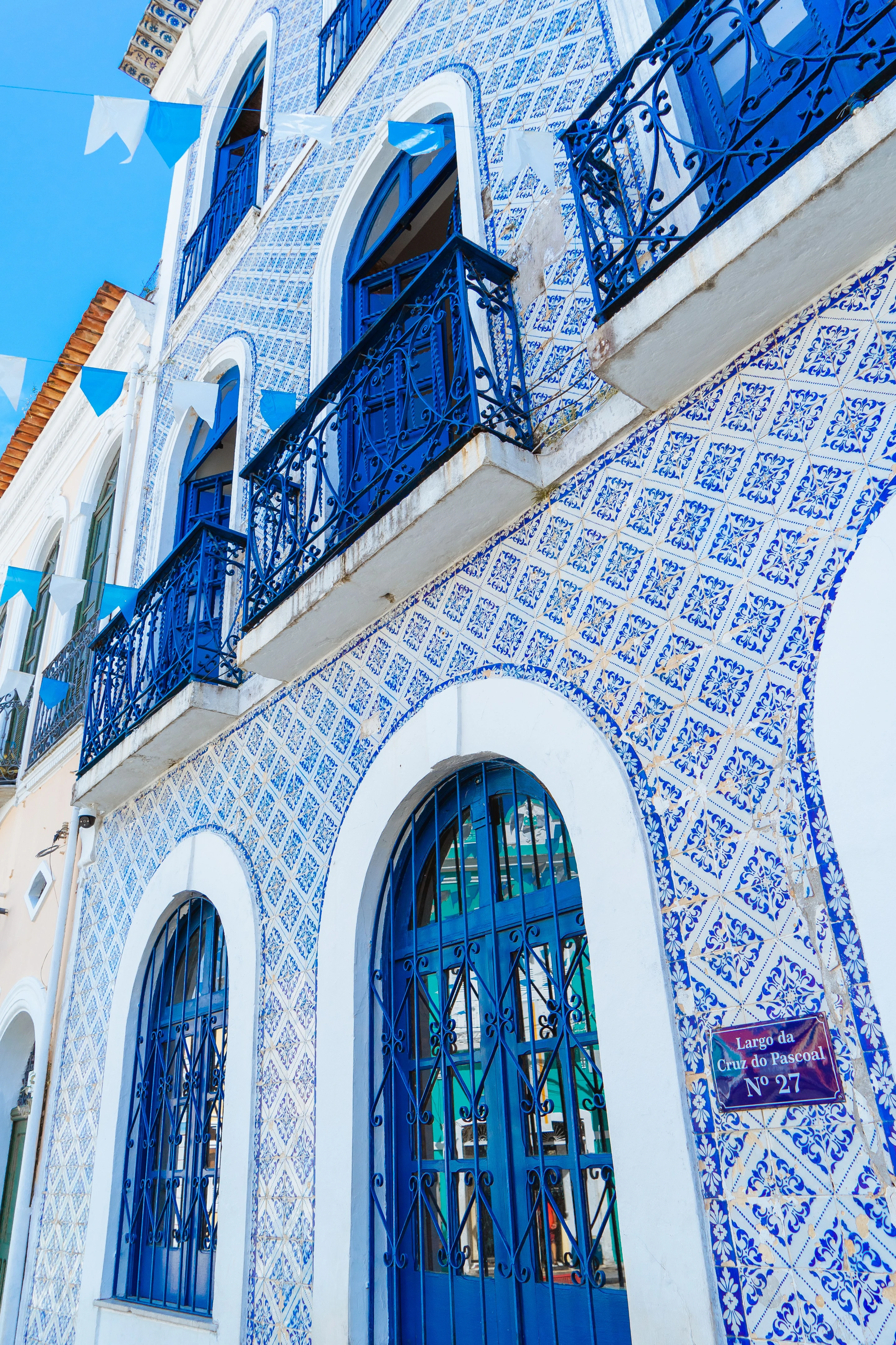 Blue-and-white tiles and balconies on Casa de Nhozinho in São Luís.