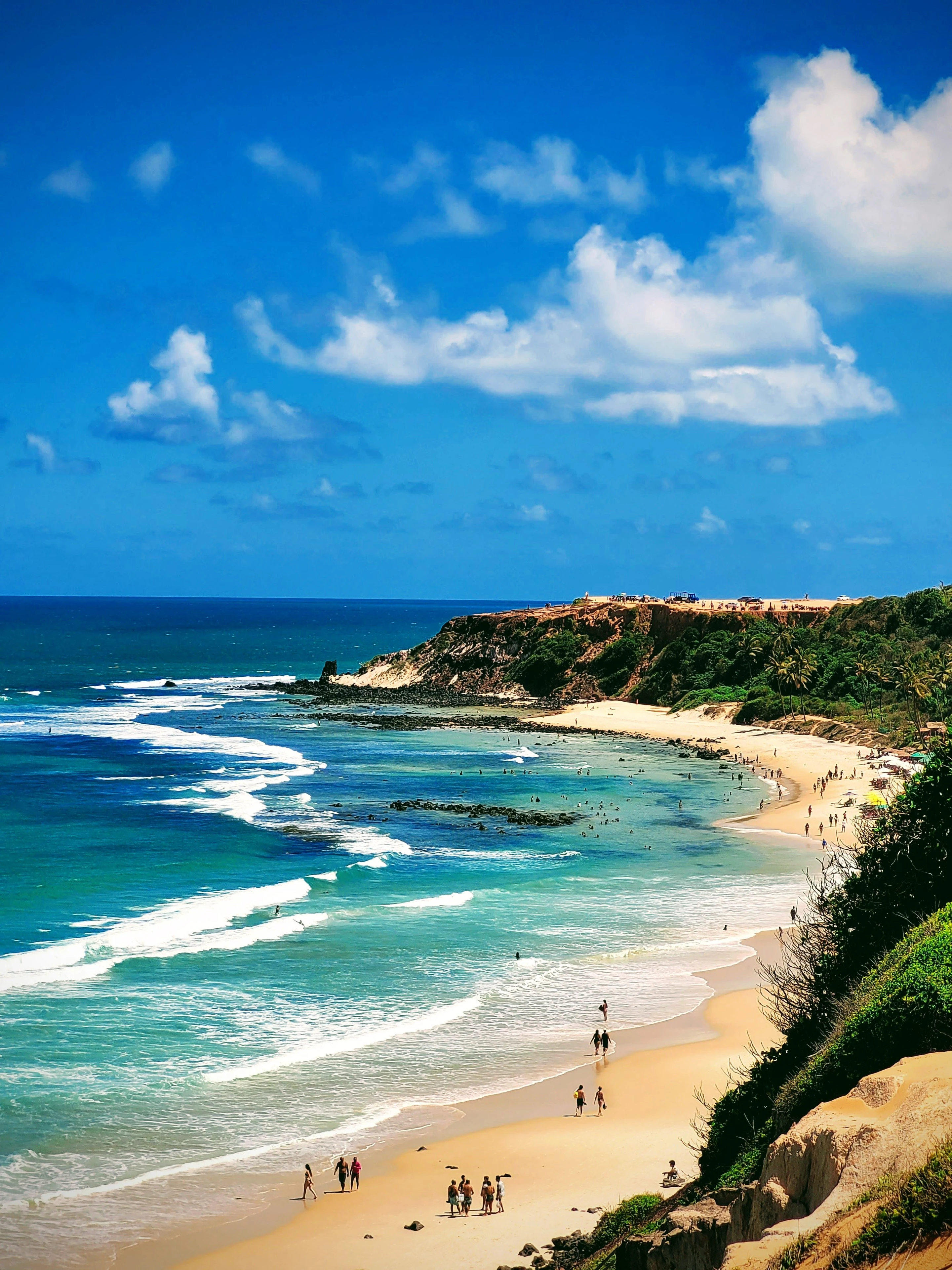The sweeping curve of Praia do Amor and its cliffs at Pipa
