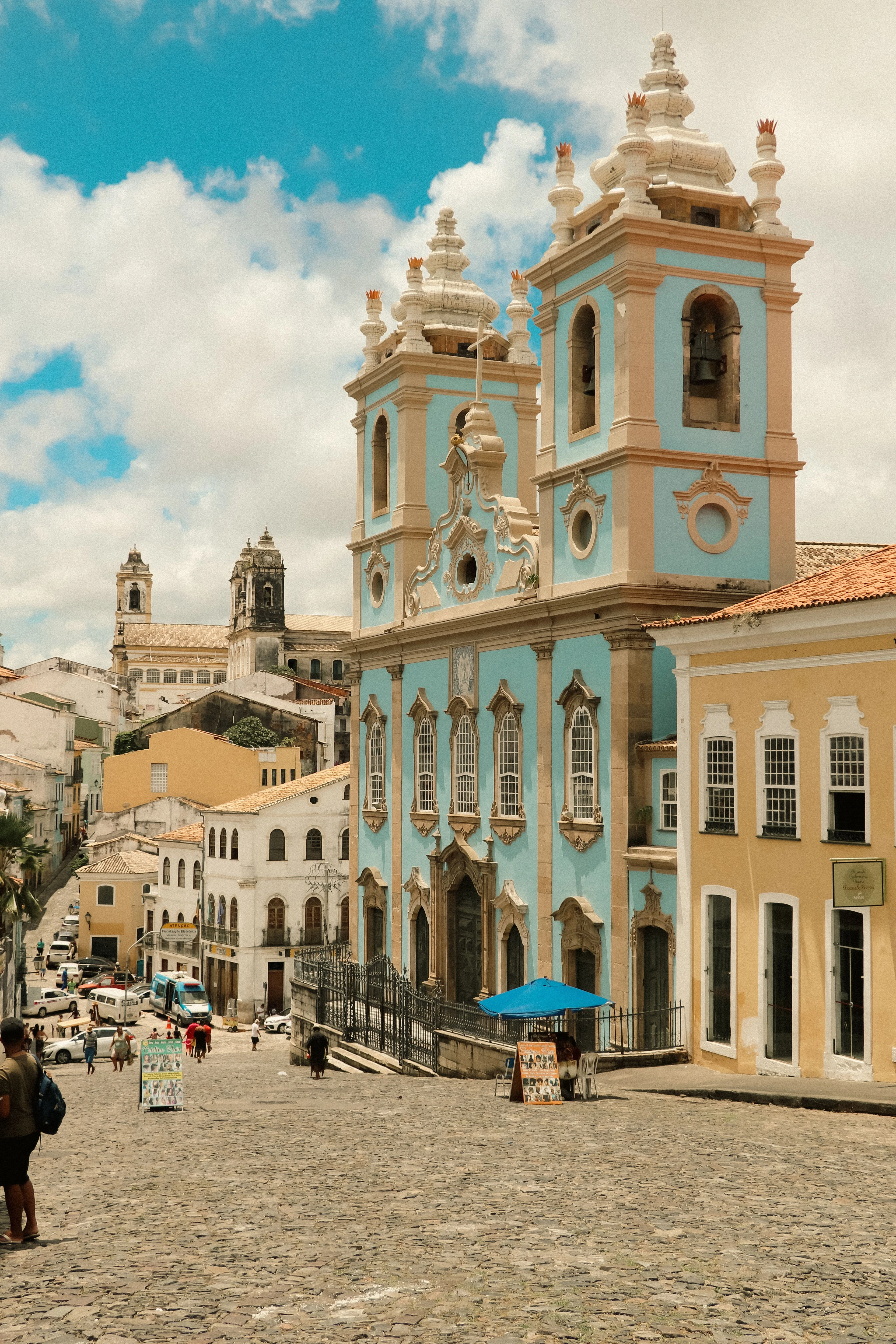 Historic church towers and colorful facades under a clear sky in Pelourinho, Salvador