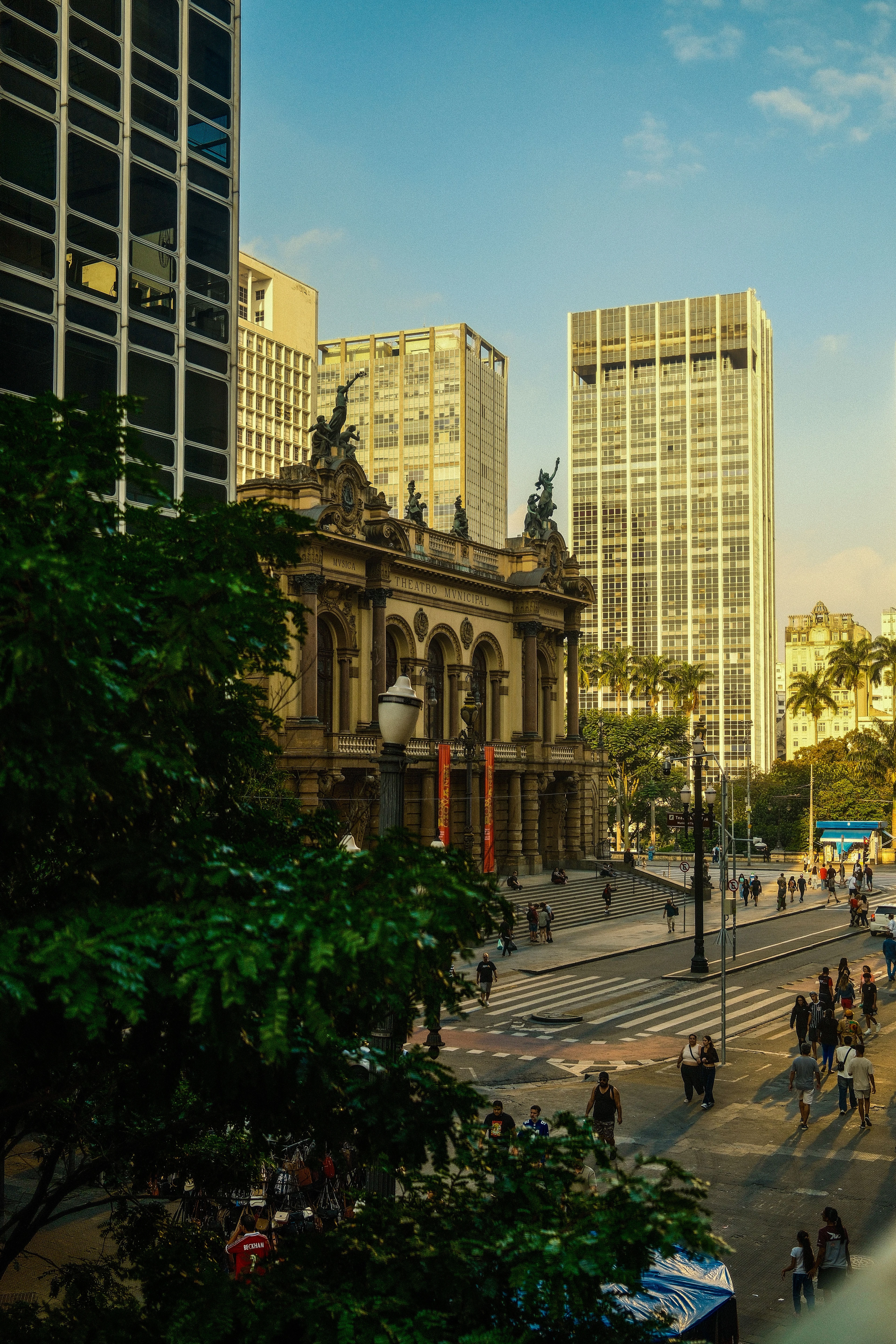 São Paulo's Theatro Municipal and street life beneath the surrounding city towers