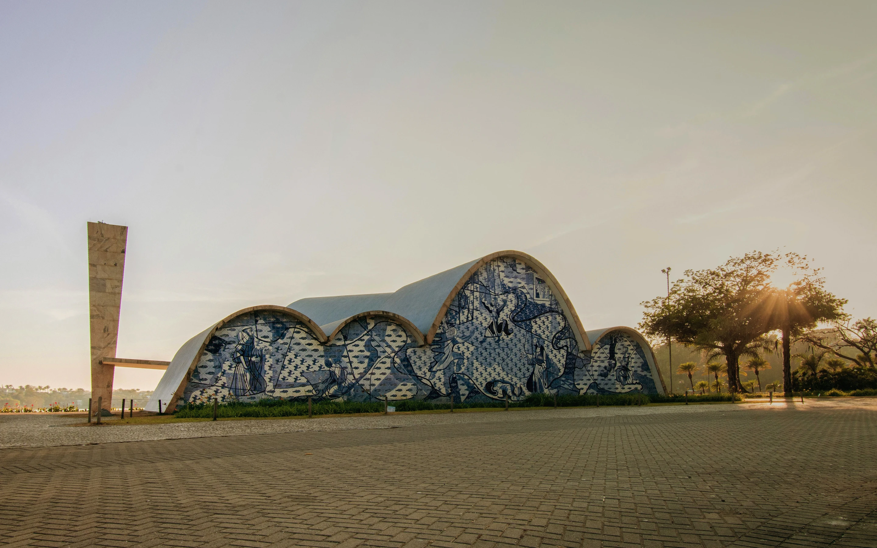 The blue tiled curves of the Igreja de São Francisco de Assis glow in low sunlight at Pampulha.