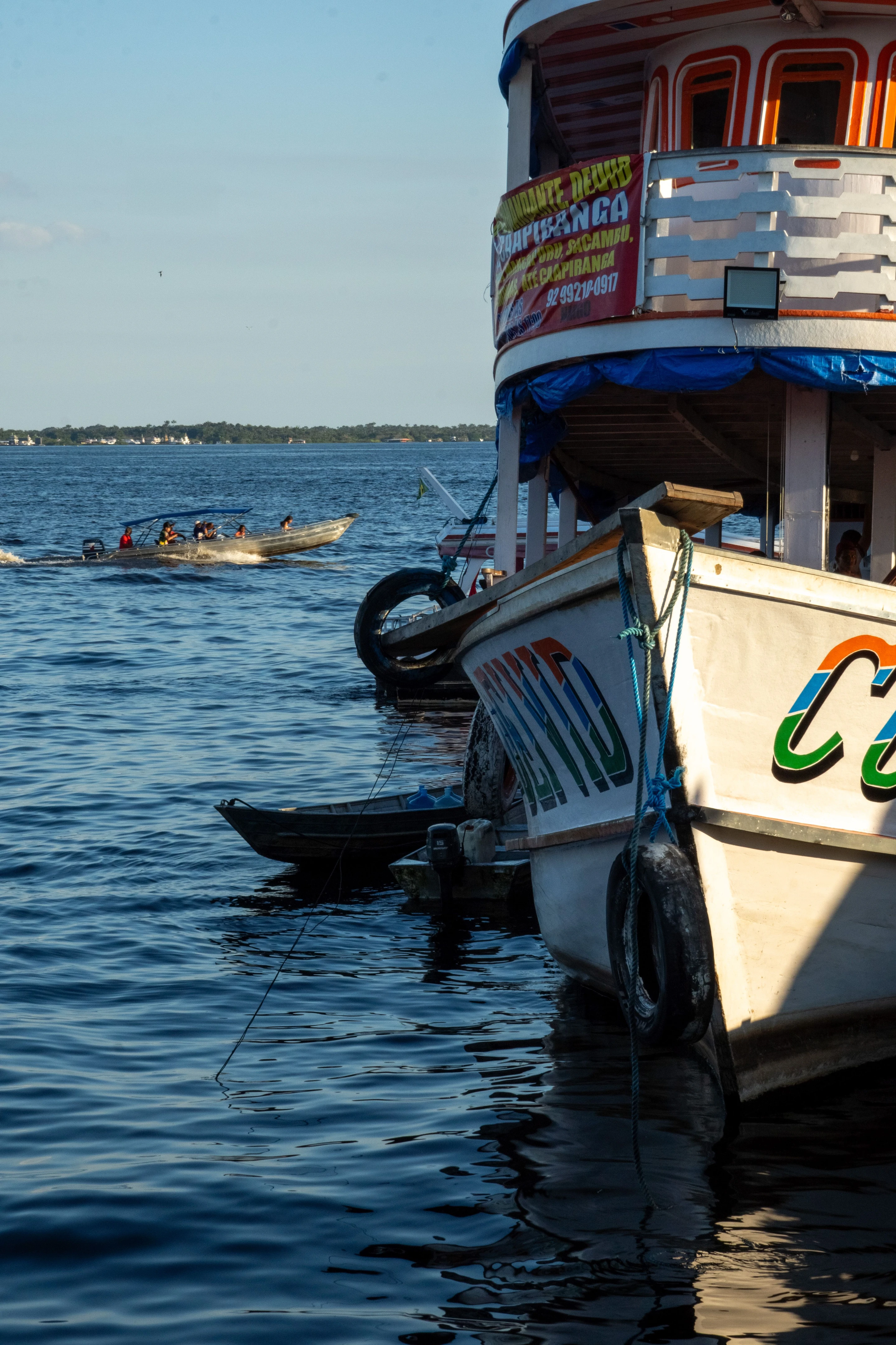 Close view of a brightly painted working river boat in Manaus