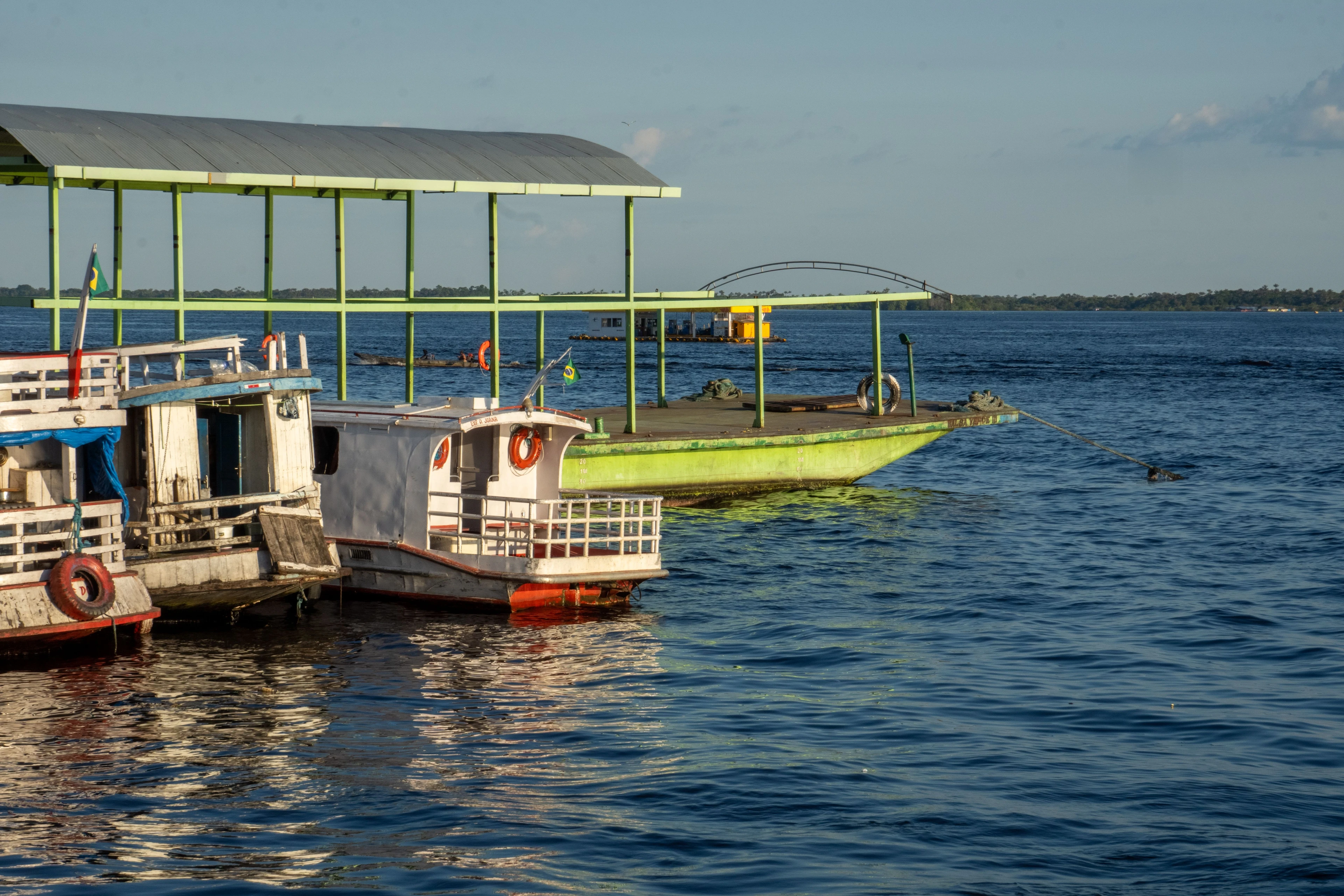 Passenger riverboats gather beside a busy Manaus dock on the Rio Negro