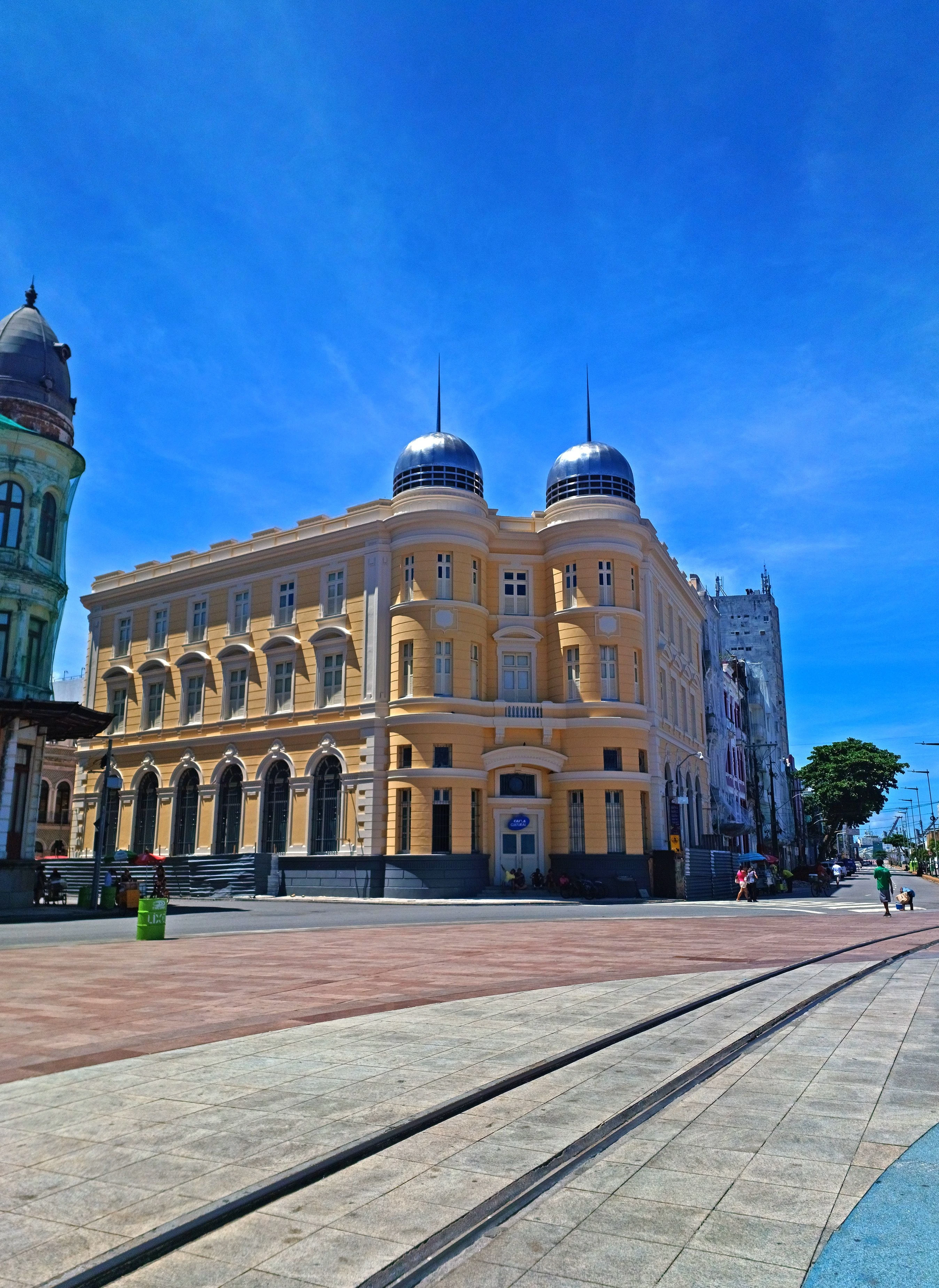 The historic Caixa Cultural facade with rounded towers and tram tracks at Recife’s Marco Zero