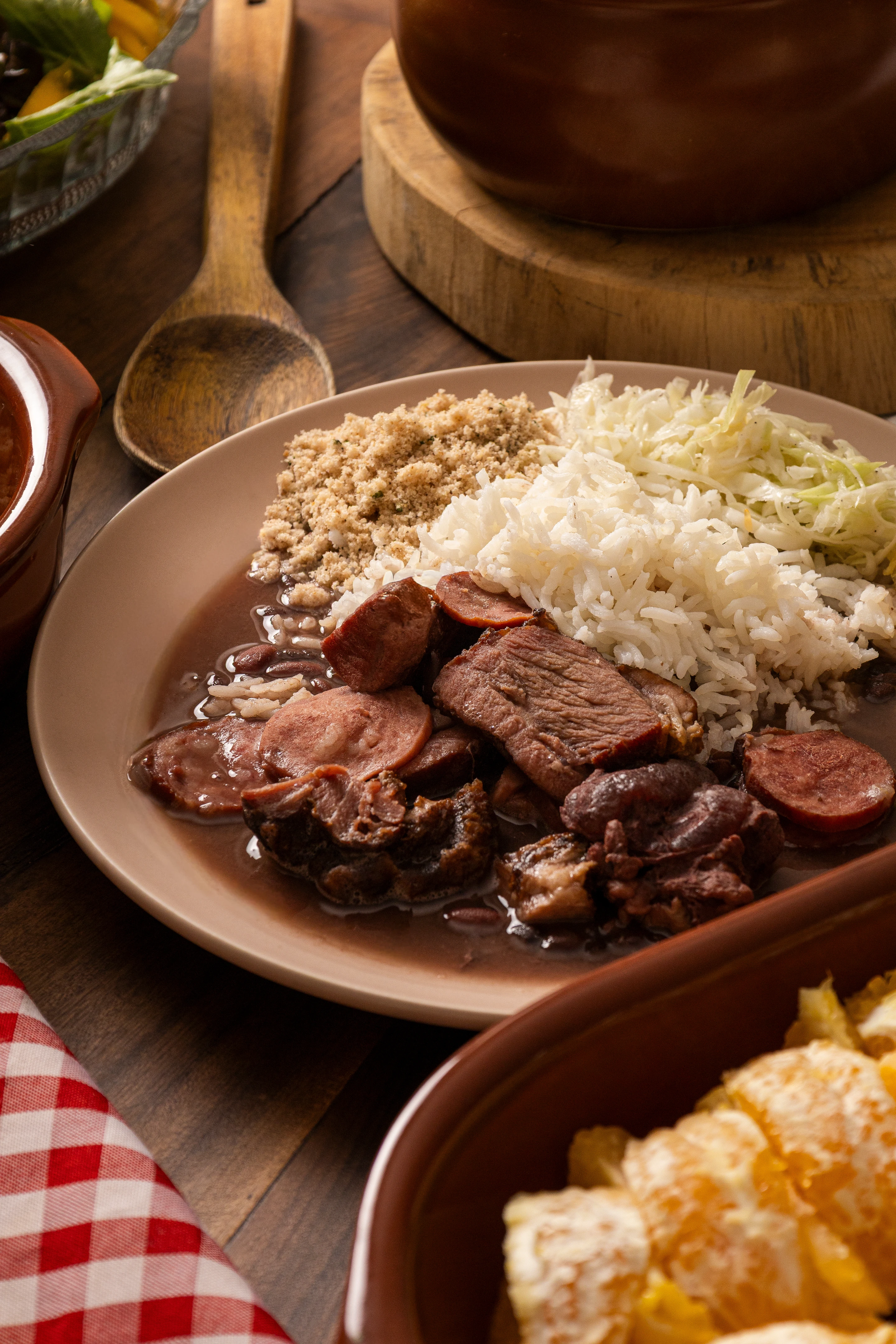 Feijoada served with rice and farofa in Brazil