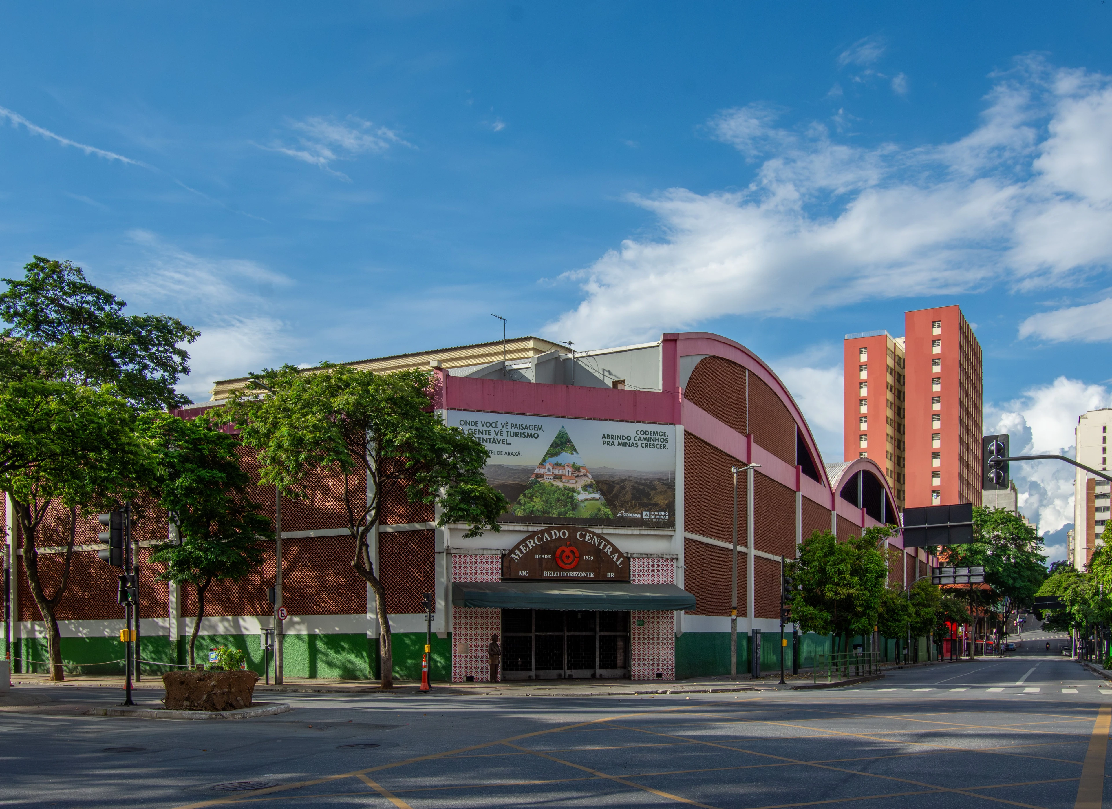 Mercado Central's pink and green exterior beneath a clear blue sky