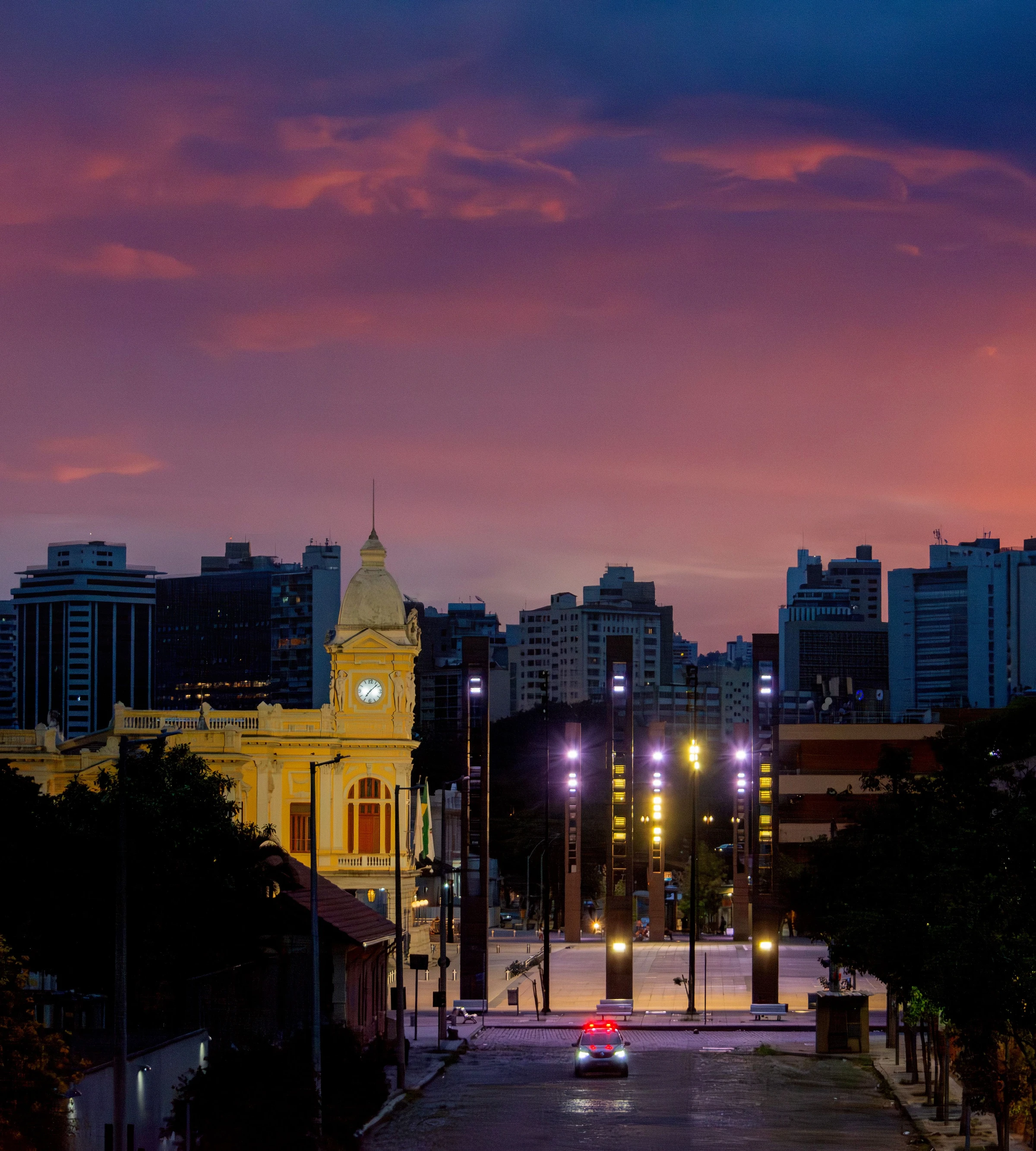 Belo Horizonte’s historic station building glows beneath a colourful evening sky.