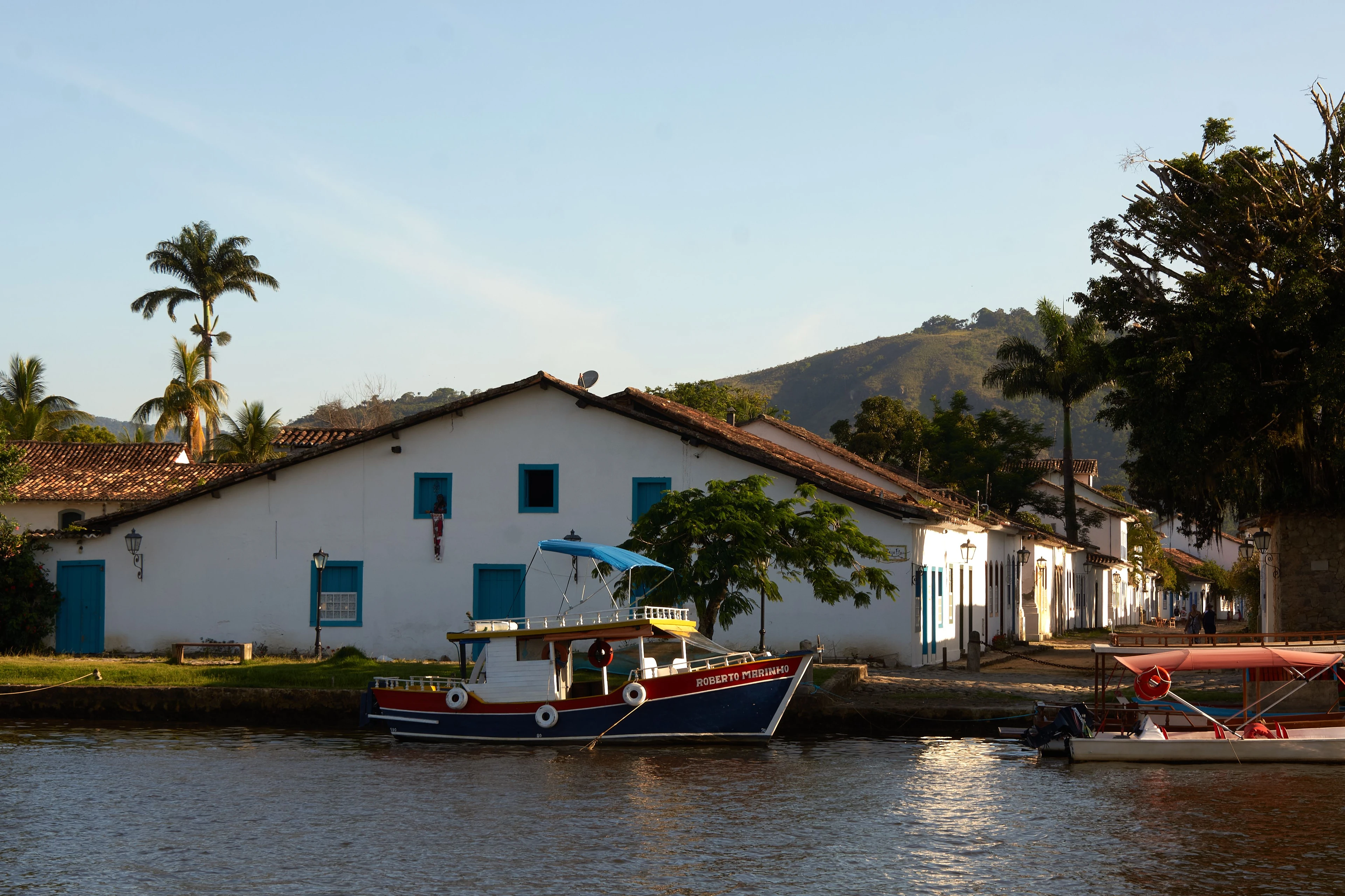Colorful wooden boats beside Paraty’s historic waterfront