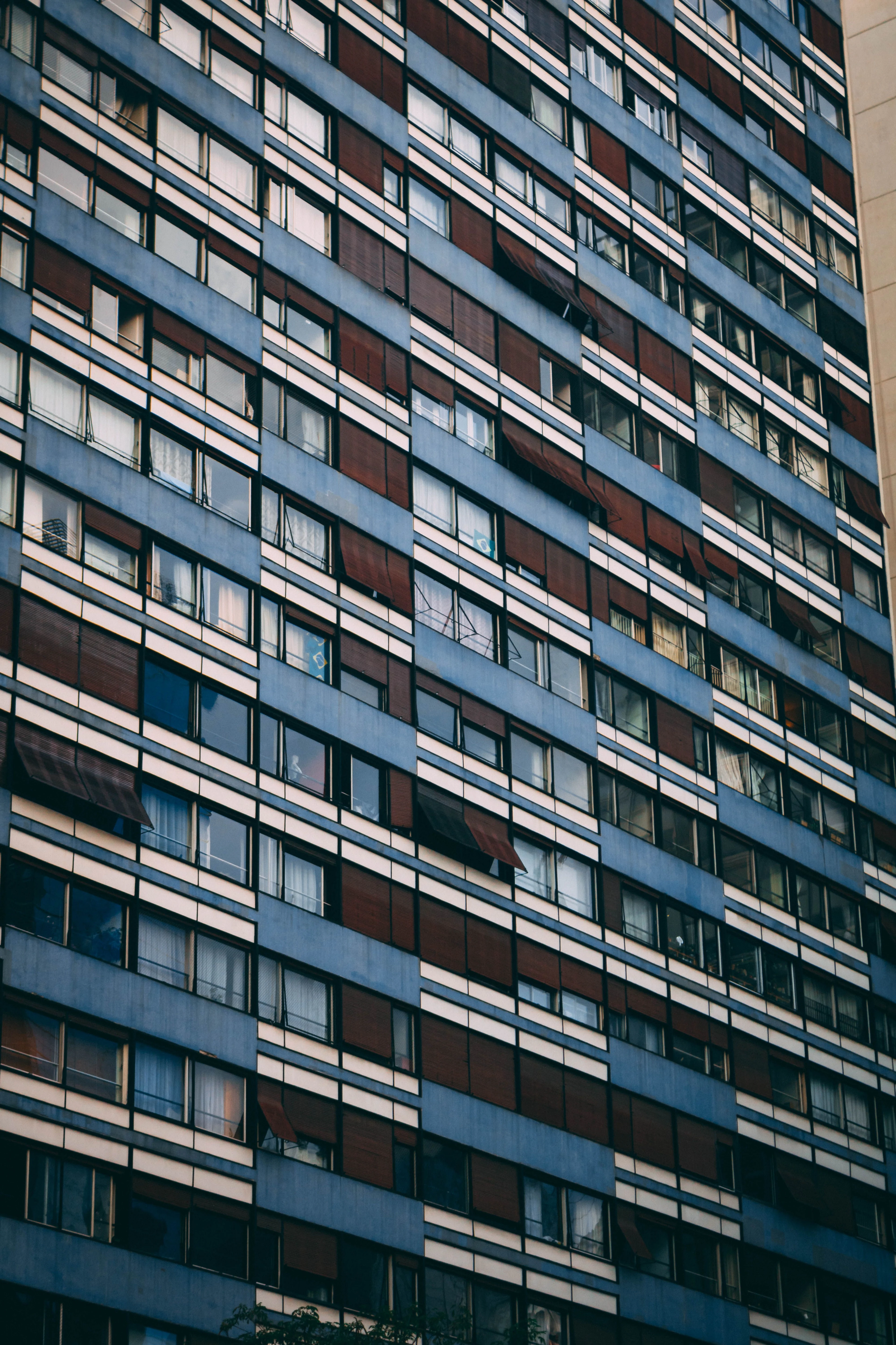 Geometric balconies and blue windows on a Bela Vista apartment building