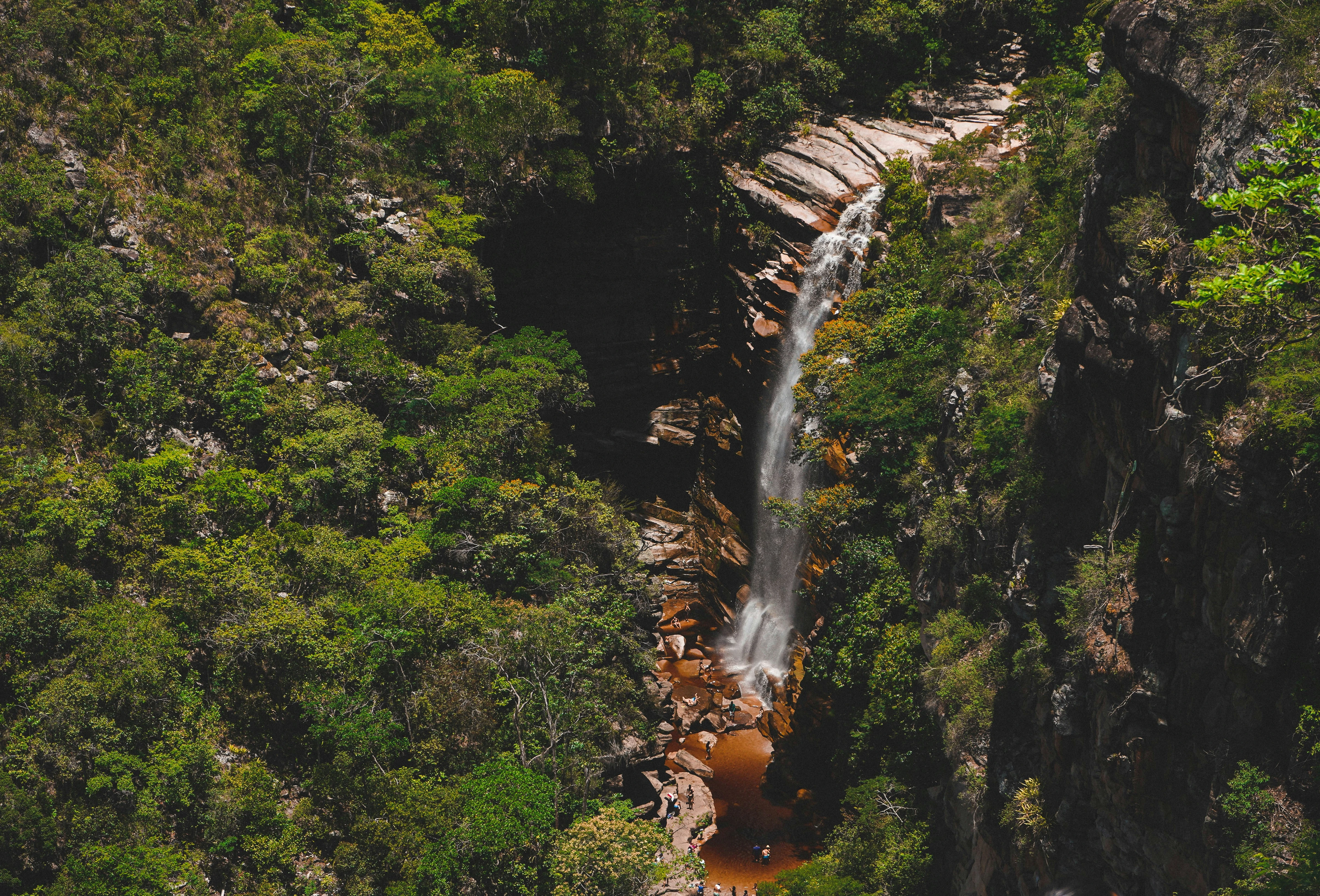 A waterfall framed by rock and vegetation at Morro do Chapéu in Bahia