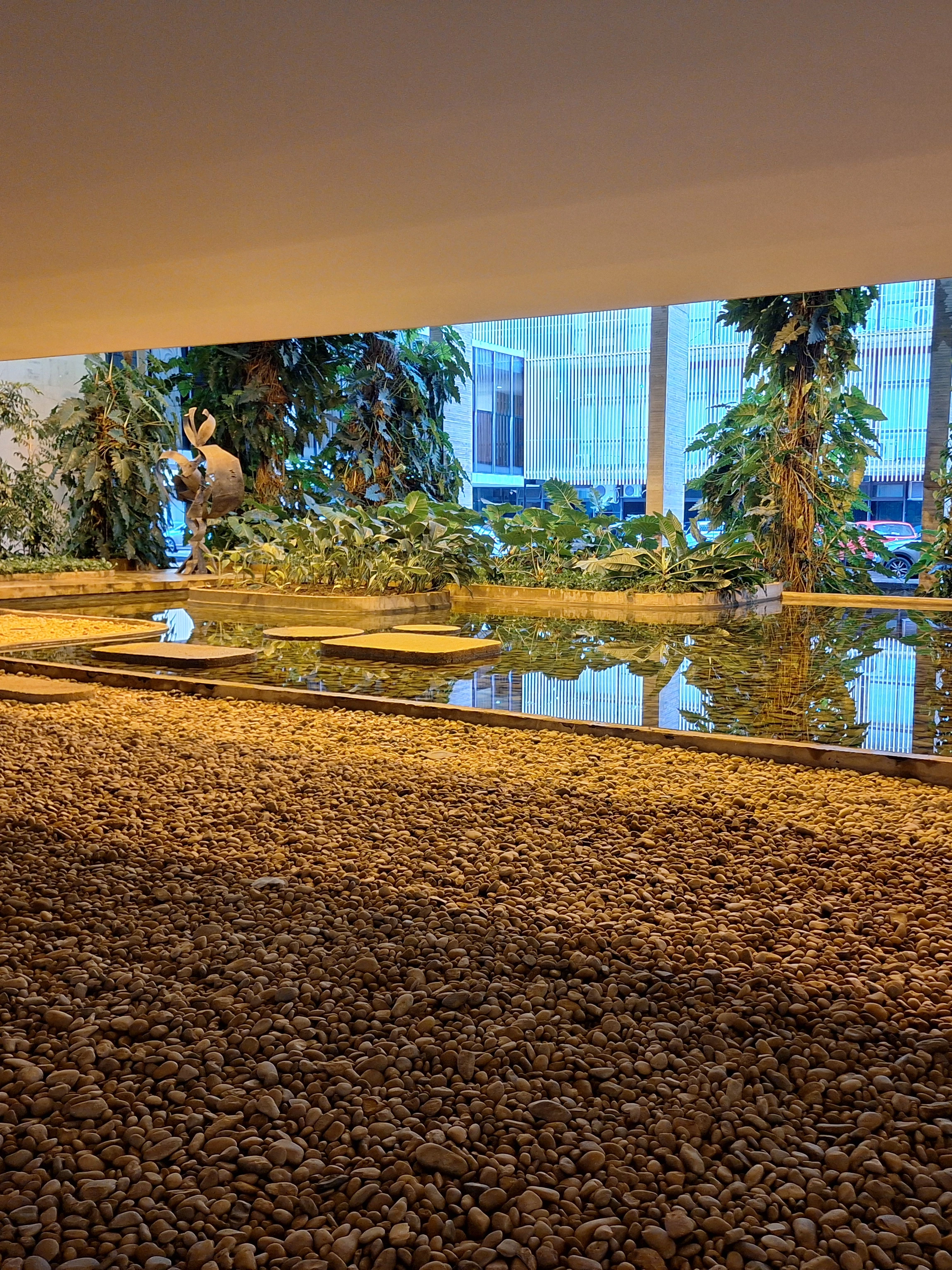 Water, planting and stone paths in the interior garden of Palácio Itamaraty in Brasília.